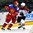 GRAND FORKS, NORTH DAKOTA - APRIL 18: Russia's Veniamin Baranov #7 and Latvia's Emils Ezitis #15 battle for position during preliminary round action at the 2016 IIHF Ice Hockey U18 World Championship. (Photo by Matt Zambonin/HHOF-IIHF Images)


